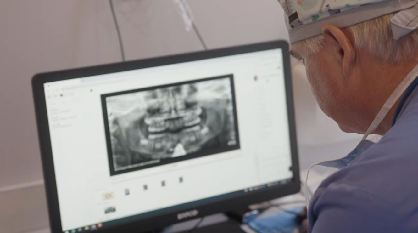 Dr. Wilkerson reviewing a child’s x-rays during an orthodontic evaluation at The Kid’s Place in Boerne, TX