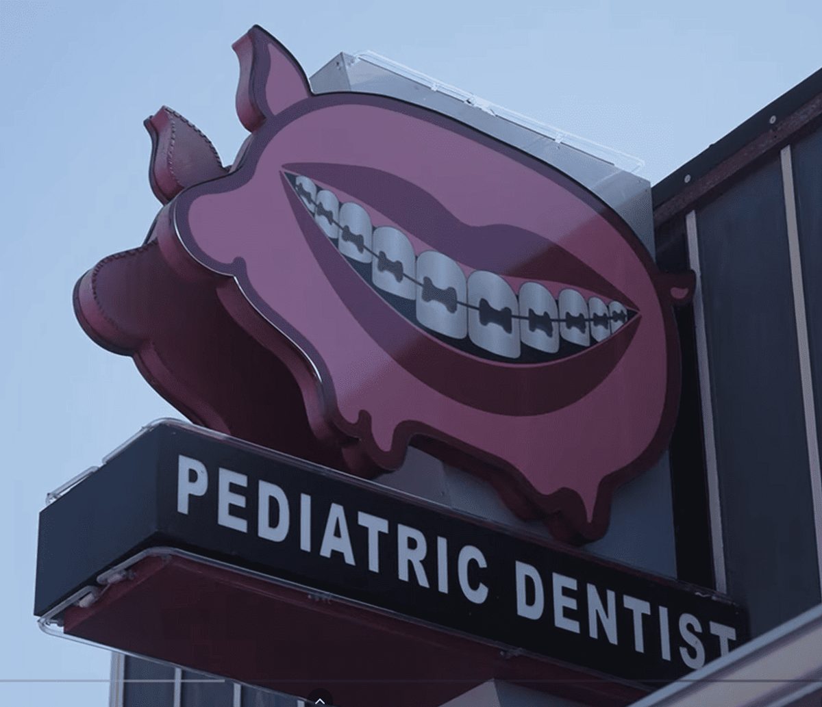 The Kid’s Place Pediatric Dentistry pig mascot sign in Boerne, TX